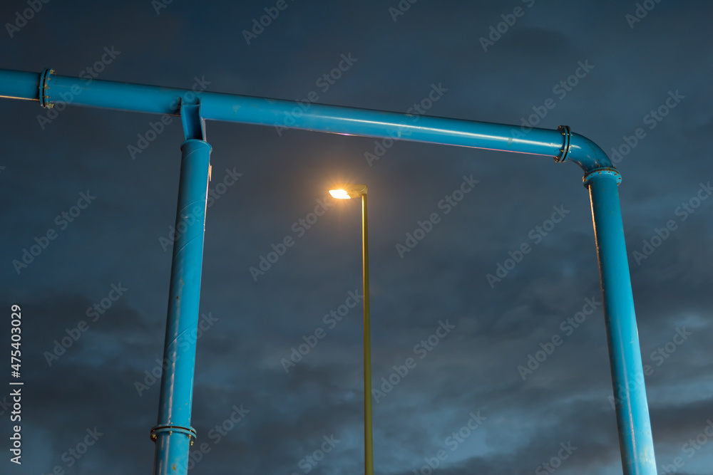 Gate from a water pipe with a street light Gate from a water pipe with a street light