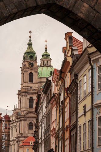 Prague, Czech Republic. View of church and other buildings from under an arch.