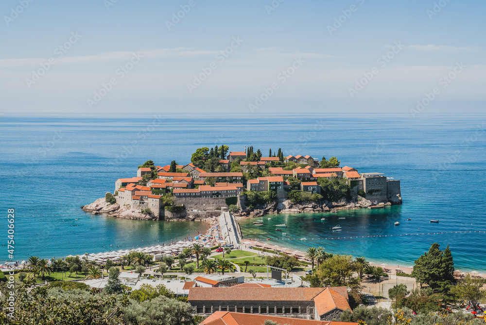 Panoramic view of Sveti Stefan Island with a promenade and beaches, Montenegro. Top view, St. Stephen islet for publication, screensaver, wallpaper, postcard, poster, banner, cover, post