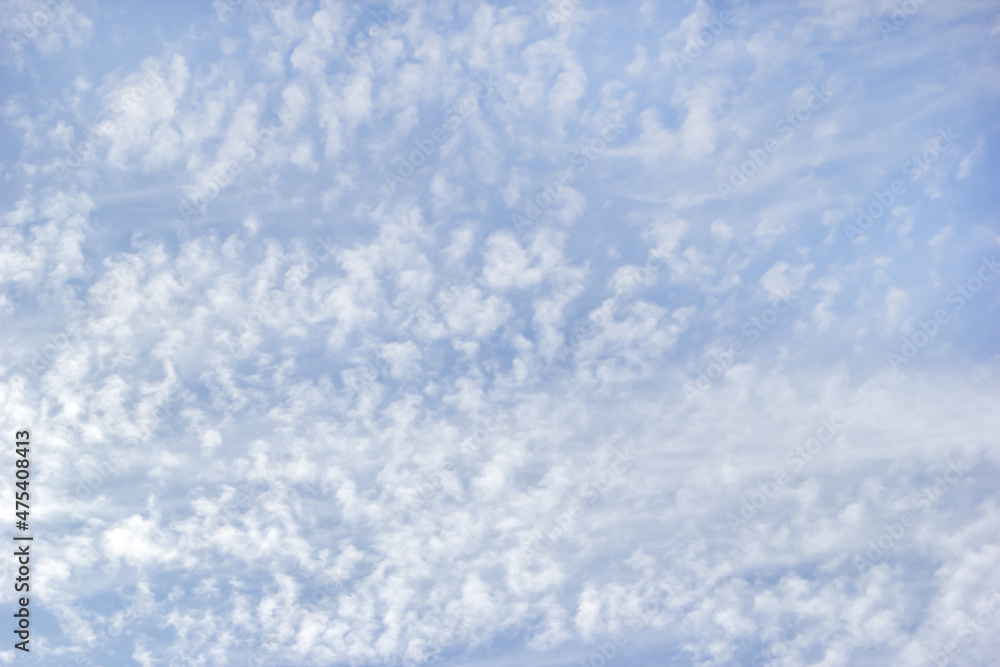 White fluffy clouds on the background blue sky. White fluffy clouds on the background blue sky.