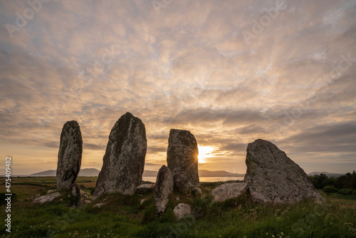 Europe, Ireland, Waterville. Eightercua stone row a sunset.