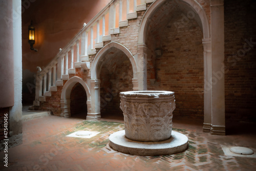 Europe, Italy, Venice. Casa Goldoni interior with stairwell and cistern. photo