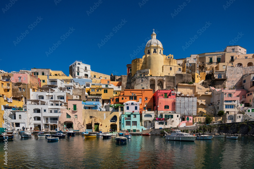 Europe, Italy, Procida. City houses and boats in Marina Corricella.
