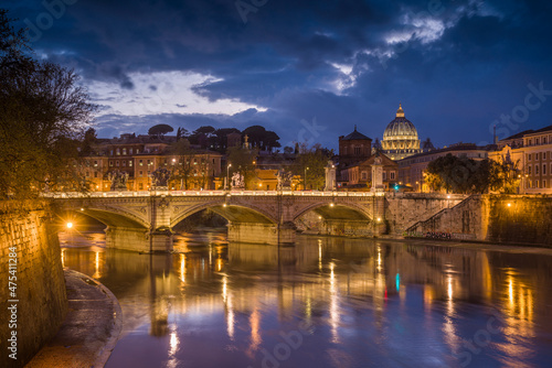 Europe, Italy, Rome. Dome of Sistine Chapel with Tiber River and bridge lit at sunset. © Danita Delimont