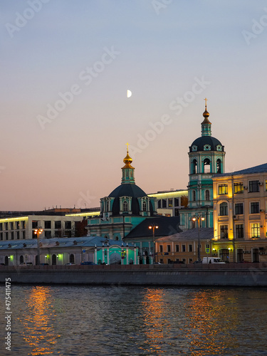 Moscow cityscape in evening. Church of St. Nicholas in Zayitsky at Raushskaya embankment. Moscow, Russia