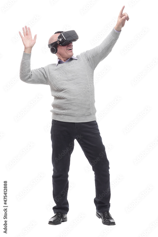 in full growth. smiling man in virtual reality glasses. in full growth. smiling man in virtual reality glasses.