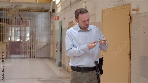 A prisoner escapes the cell from the behind of the guardian who distracted by checking his attributes