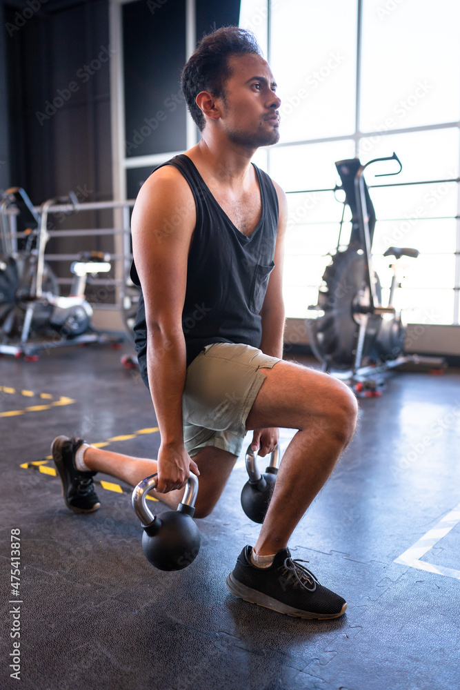 person doing lunges in a gym person doing lunges in a gym