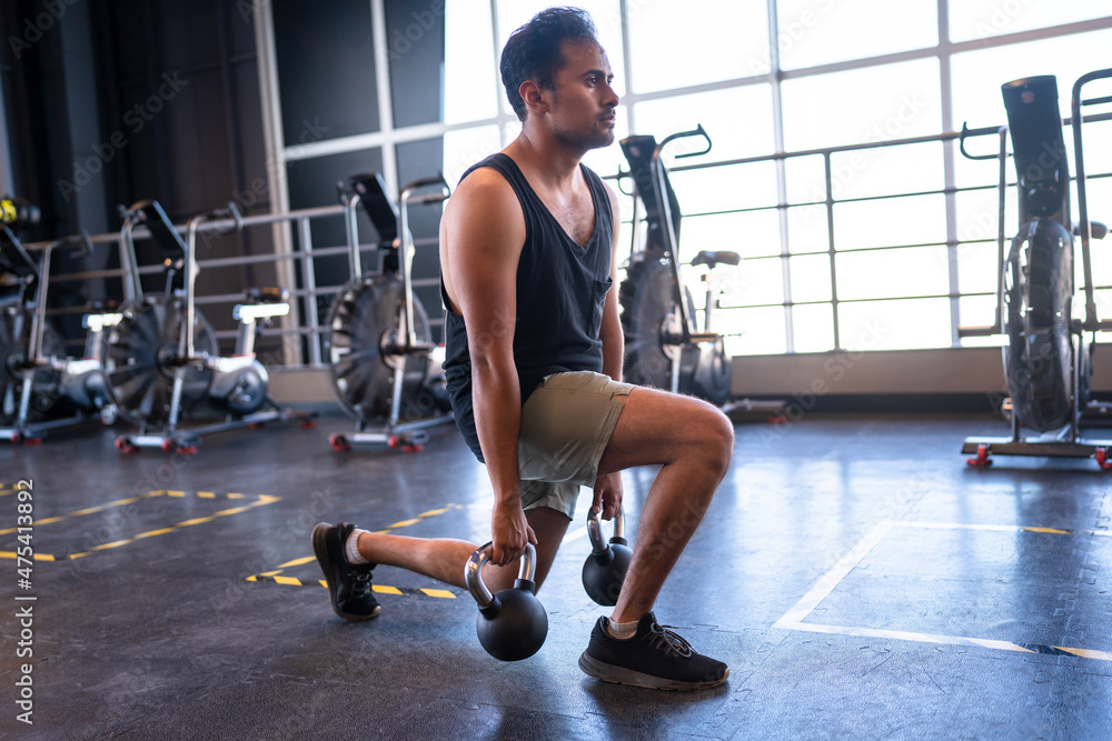 person doing lunges in a gym person doing lunges in a gym
