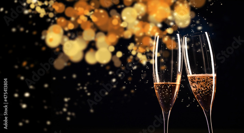 champagne glasses on bokeh background happy New Year
