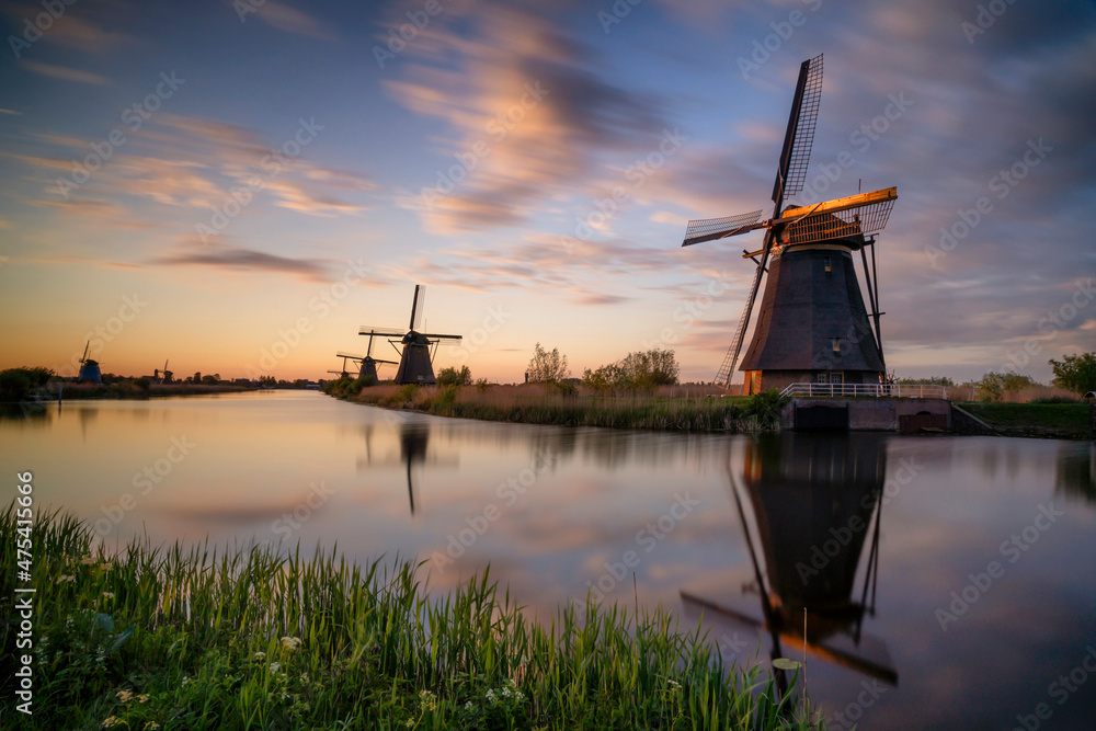 Europe, The Netherlands. Kinderdijk windmills at sunset.