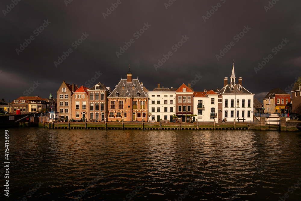 Europe, The Netherlands, Maassluis. Row of buildings on ocean pier.