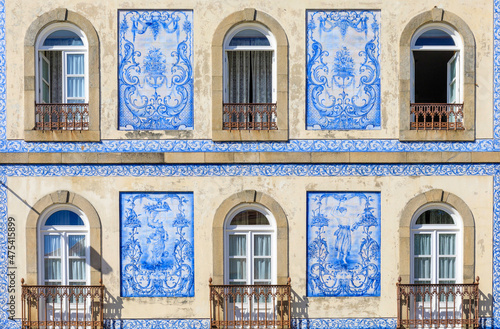 Europe, Portugal, Aveiro. Tiled facade and windows on house.