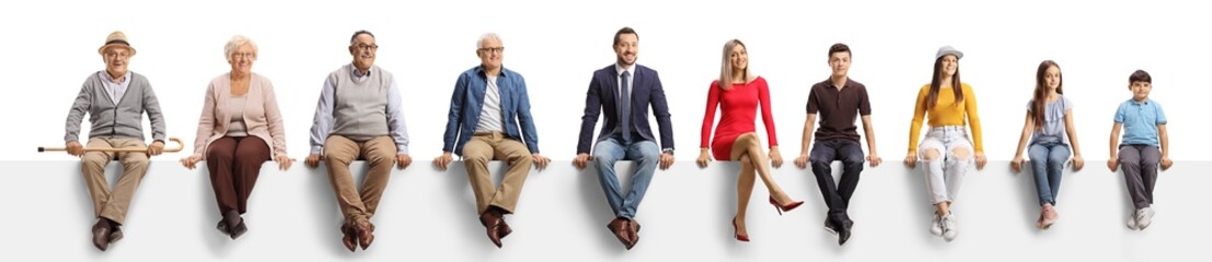 People of different age sitting on a blank panel and looking at camera