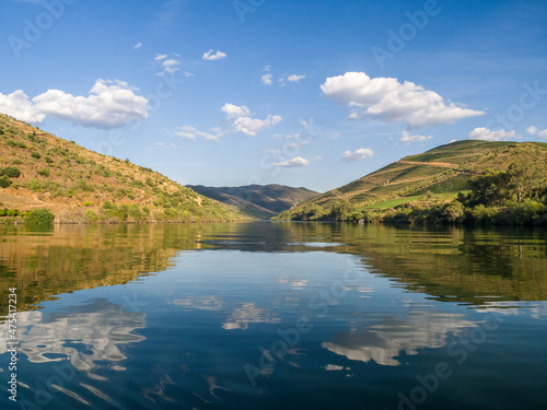Portugal, Douro Valley. The Douro River with hillsides of terraced vineyards.
