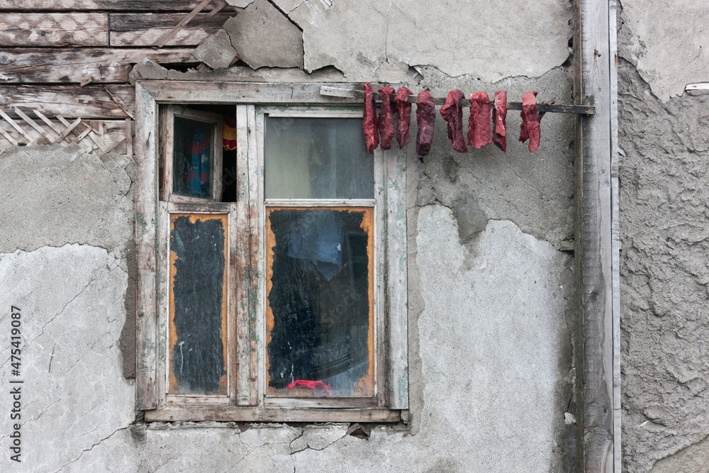 Drying walrus meat by the window, Uelen village, the most northeastern village in Russia, Russian Far East