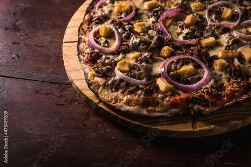 Delicious Pizza Classic Homemade Tomato Sauce Sausage Cheese Onion Chicken Meat Pasta Shrimp Restaurant Menu Gourmet on a wooden table Dark Background