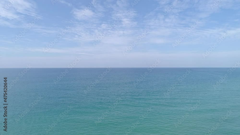 Tropical sea with turquoise ocean water and waves crashing on sandy shore Aerial view sea paradise island Top down view Tropical sea with turquoise ocean water and waves crashing on sandy shore Aerial view sea paradise island Top down view