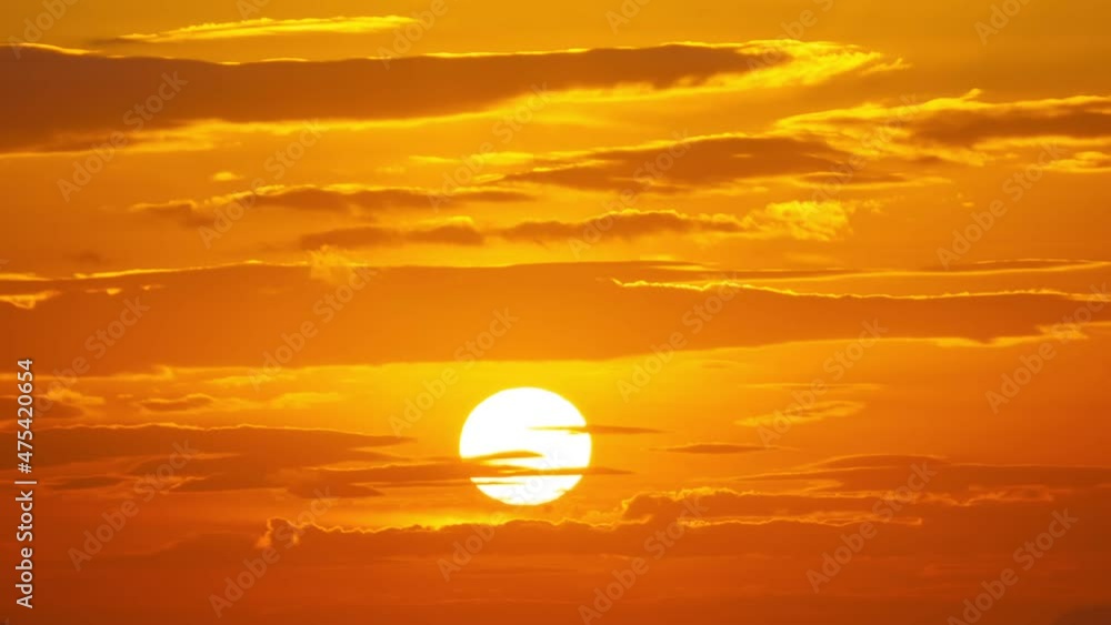 Timelapse of Beautiful sunset sun Close Up Big red hot Sun in golden hour Above Horizon Amazing light of nature over sea in Phuket island on December 12-2021 Timelapse of Beautiful sunset sun Close Up Big red hot Sun in golden hour Above Horizon Amazing light of nature over sea in Phuket island on December 12-2021