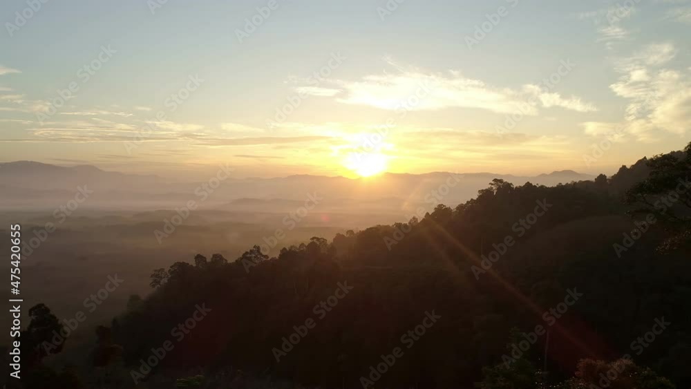 Aerial view Drone flying through the fog above mountain peak Beautiful light sunrise or sunset nature Landscape Amazing video cinematic nature view in Thailand on December 15-2021 Aerial view Drone flying through the fog above mountain peak Beautiful light sunrise or sunset nature Landscape Amazing video cinematic nature view in Thailand on December 15-2021