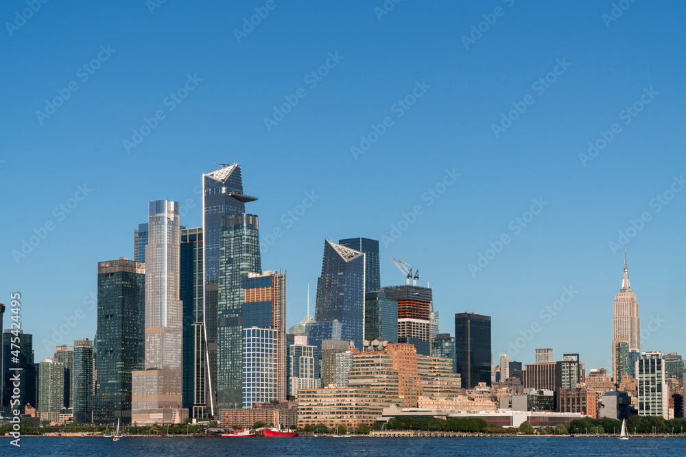 New York City skyline from New Jersey over the Hudson River with the skyscrapers of the Hudson Yards district at day time. Manhattan, Midtown, NYC, USA. A vibrant business neighborhood