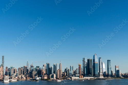 New York City skyline from New Jersey over the Hudson River with the skyscrapers of the Hudson Yards district at day time. Manhattan, Midtown, NYC, USA. A vibrant business neighborhood
