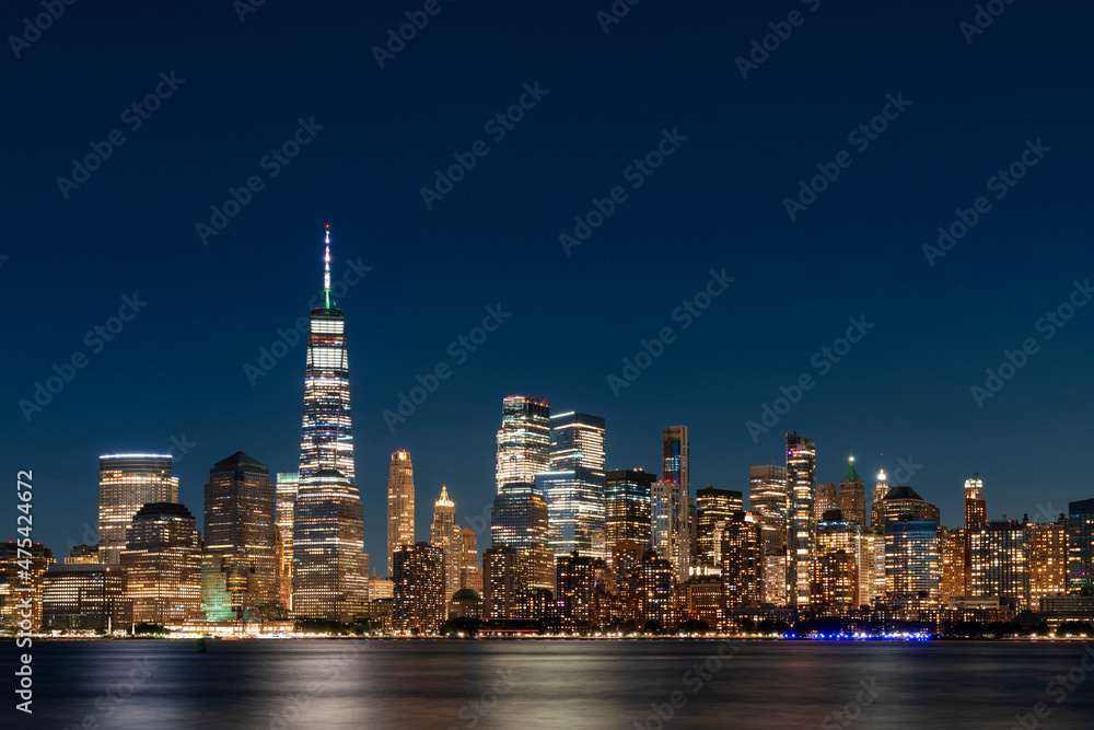 Skyline of New York City Financial Downtown Skyscrapers at night. Manhattan, NYC, USA. A vibrant business neighborhood