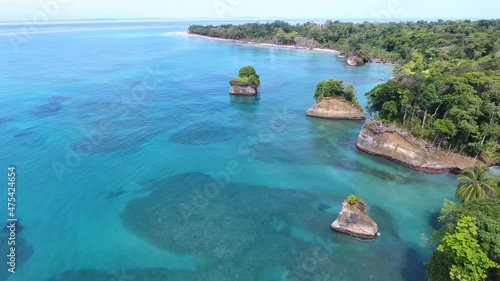 Aerial of  Tropical Island with Tan Cliffs, Tropical Trees and Beaches