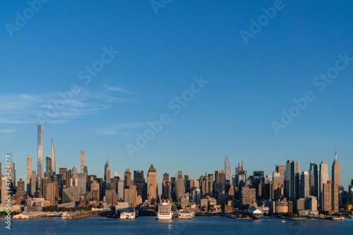 Aerial New York City skyline from New Jersey over the Hudson River with the skyscrapers of the Hudson Yards district at sunset. Manhattan  Midtown  NYC  USA. A vibrant business neighborhood
