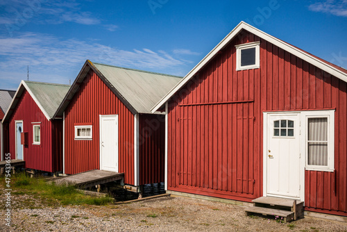 Sweden, Bohuslan, Hamburgsund, red fishing shacks photo