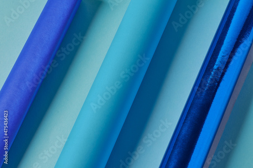 Sky blue, turquoise blue, royal blue and sky blue paper tubes.