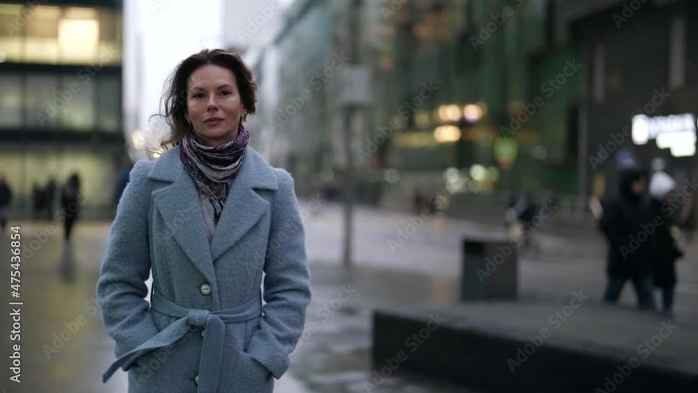 city life shot, charming lady is walking alone in city centre in autumn day city life shot, charming lady is walking alone in city centre in autumn day