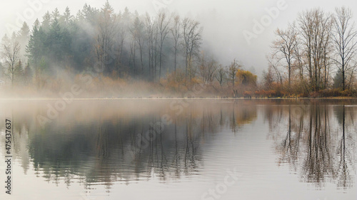 Calm lake on a foggy morning in Mill Lake, Canada photo