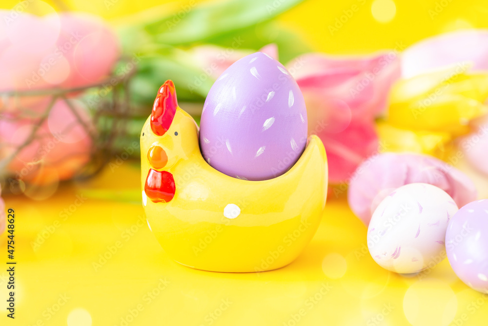 Easter greeting card with decorative chicken and painted eggs. Easter concept