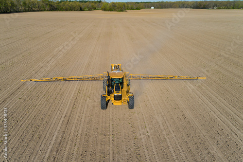 Aerial view of a sprayer applying chemicals to a corn field, Marion County, Illinois
