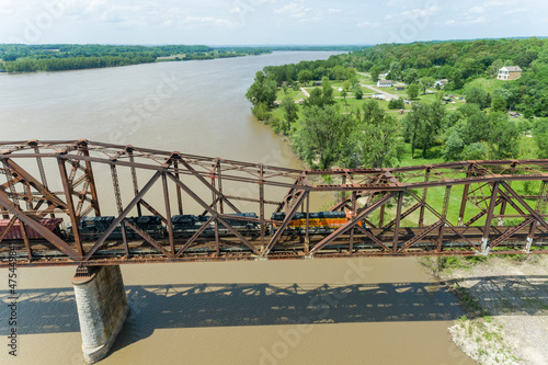 Leinwand Poster Freight train on Union Pacific railroad crossing the Mississippi river on the Th