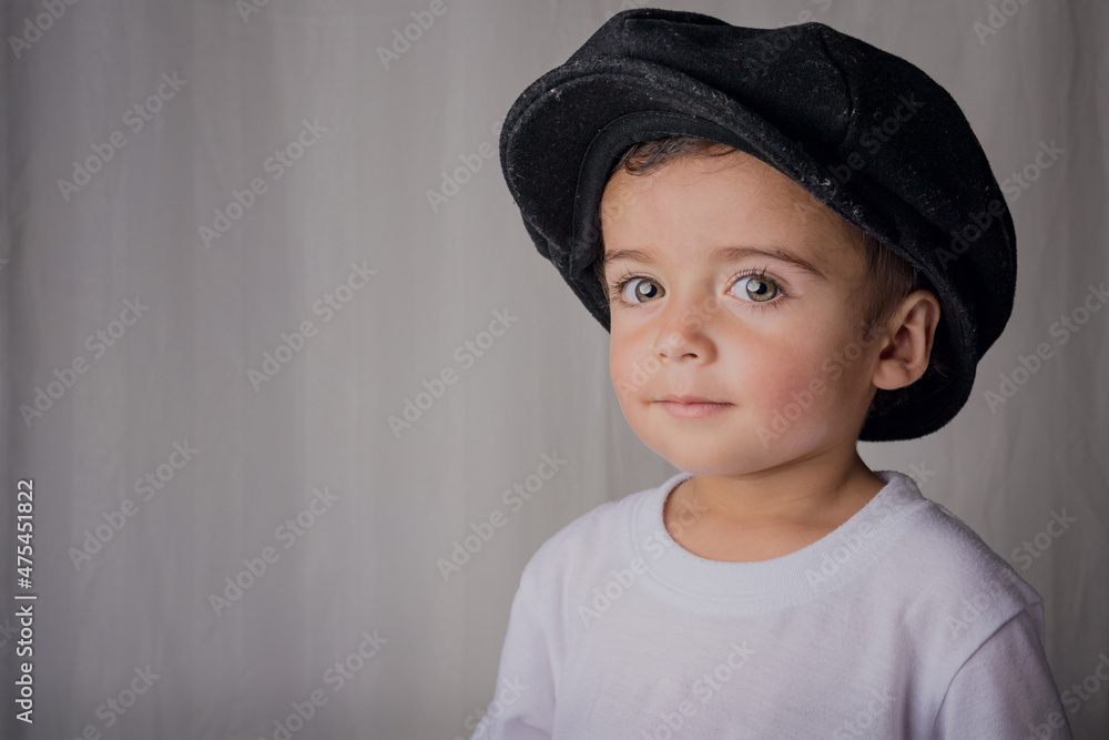 portrait of a little boy wearing an antique hat portrait of a little boy wearing an antique hat