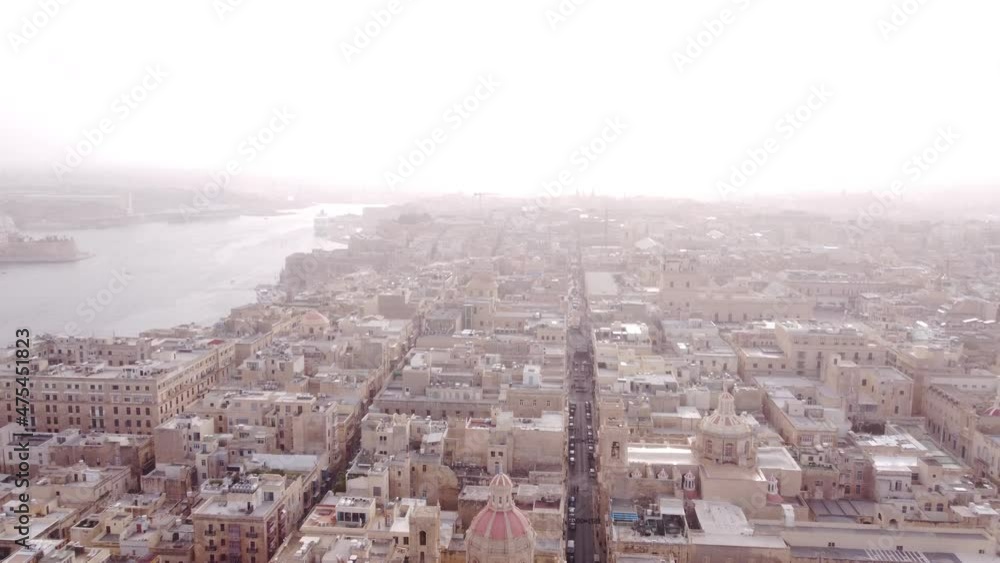 Very Hazy day over Valetta Malta as drone flies backwards out to the castle Very Hazy day over Valetta Malta as drone flies backwards out to the castle