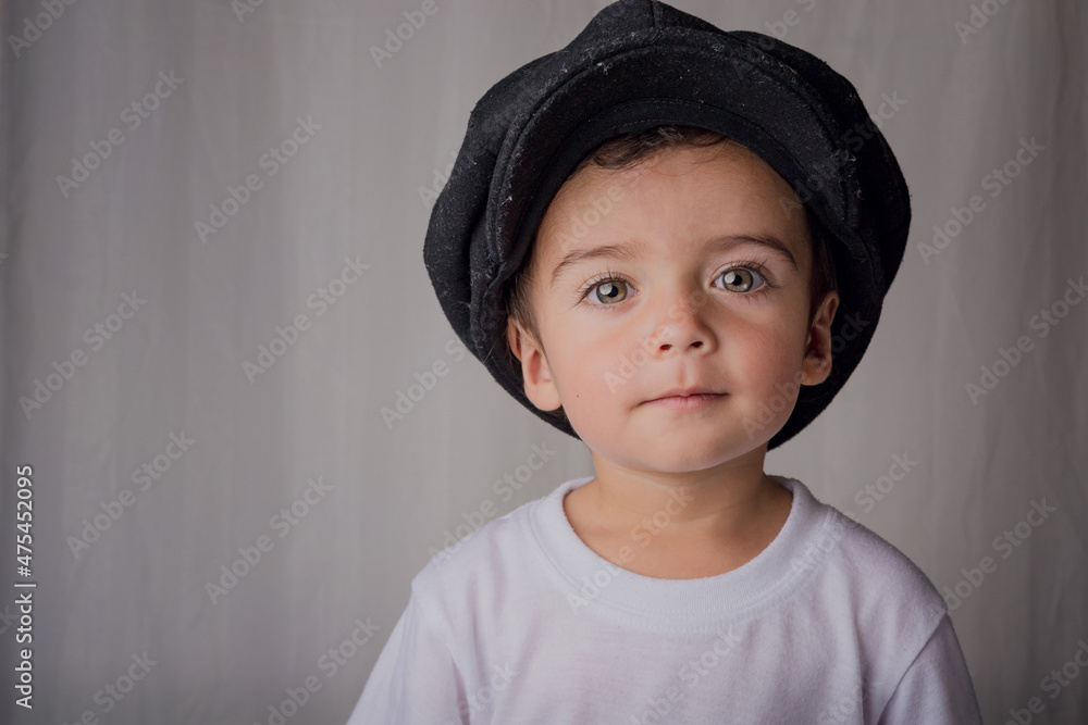 portrait of a little boy wearing an antique hat portrait of a little boy wearing an antique hat