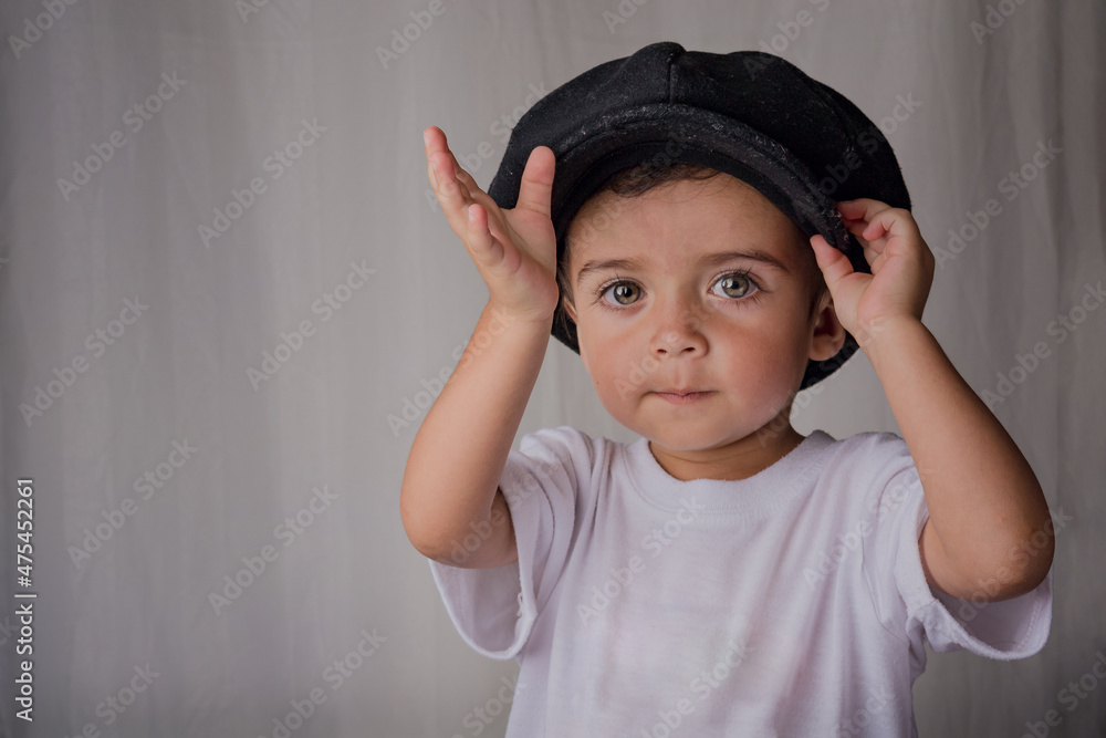 portrait of a little boy wearing an antique hat portrait of a little boy wearing an antique hat