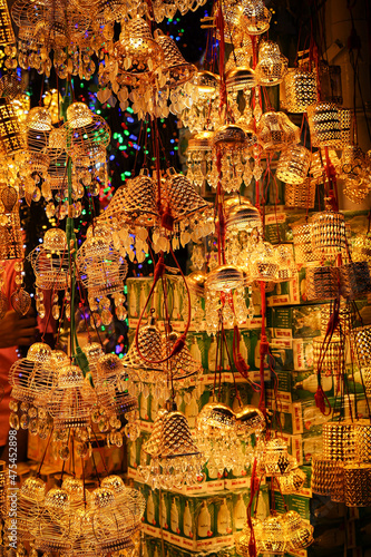 Ornamental lights Christmas light lightning lantern star hanging Christmas market Kerala India lots of bright colorful stars night photo. Indian winter holidays shopping for x-mas New Year celebration