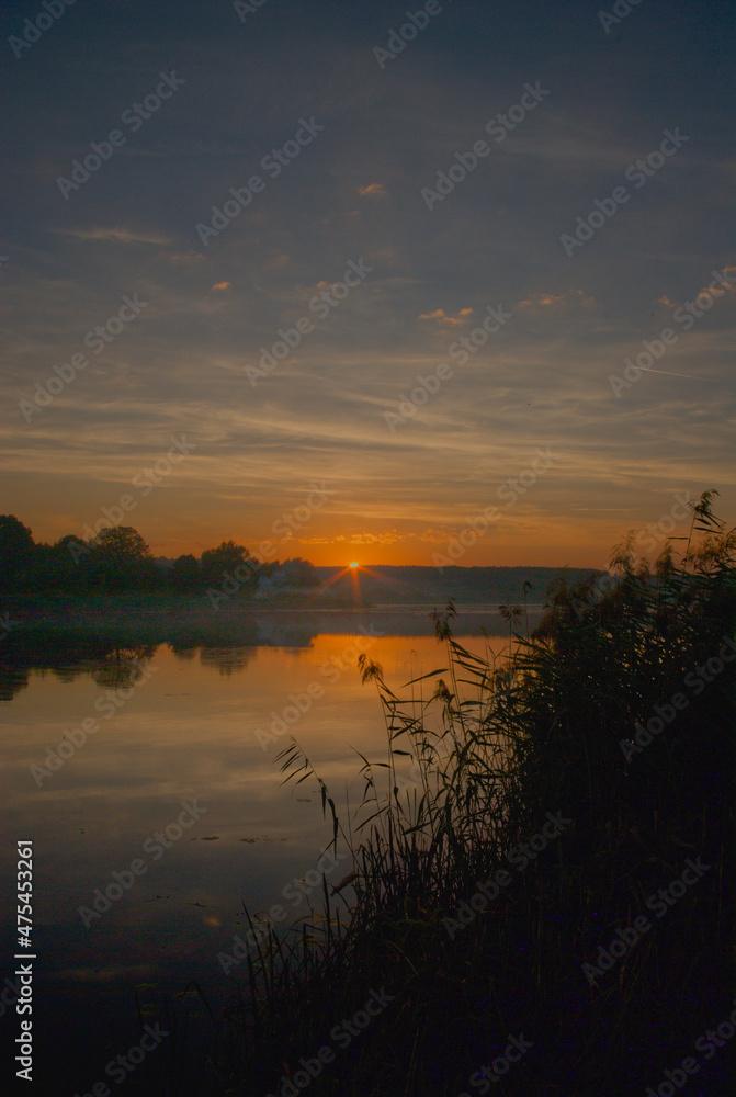 Fototapeta premium sunset over the river