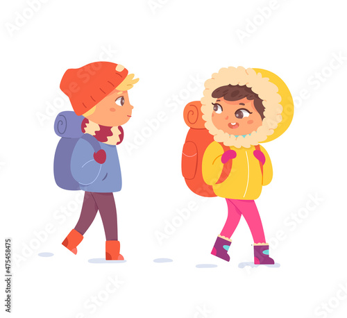 Kids with backpacks hiking in winter, girl and boy explorers hike, enjoy snow weather