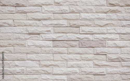 Cream and beige brick wall texture background. Brickwork and stonework flooring interior rock old pattern vintage brick wall backdrop