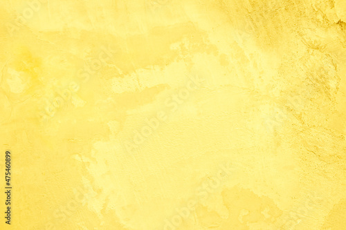 Concrete wall yellow color for texture background. Abstract grunge bright colorful color with growing effect.with roughness and irregularities.