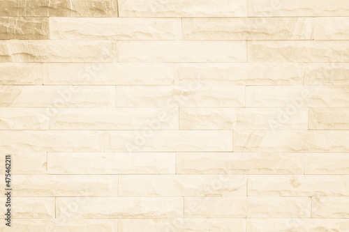 Empty background of wide cream brick wall texture. Beige old brown brick wall concrete or stone textured, wallpaper limestone abstract