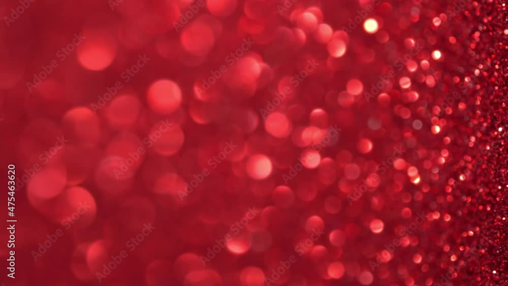 Red Glitter Background. Magic dust, shiny texture, holiday lights, flying particles form a beautiful bokeh. Shining festive Christmas backdrop. Vertical Video Red Glitter Background. Magic dust, shiny texture, holiday lights, flying particles form a beautiful bokeh. Shining festive Christmas backdrop. Vertical Video