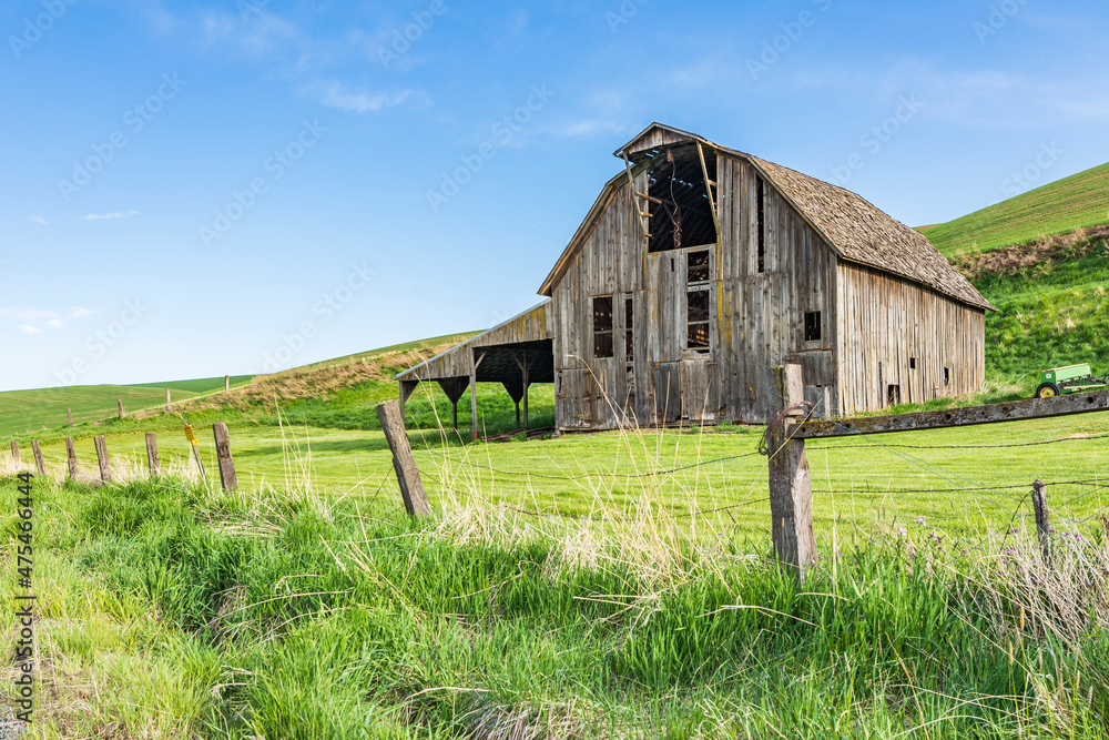 Pullman, Washington State, USA. A gray weathered barn in the Palouse hills. (Editorial Use Only)