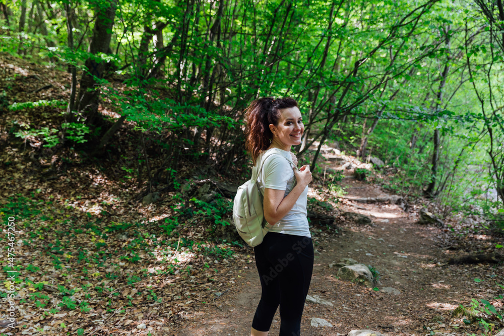woman traveler in green forest hiking adventure woman traveler in green forest hiking adventure