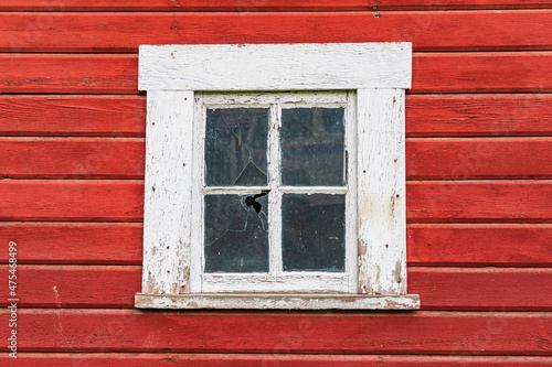 Latah  Washington State  USA. White framed window in a red barn.